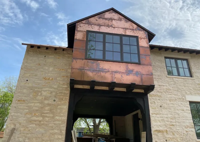 Copper metal panel facade on a stone building for Skylight Installation in Placerville