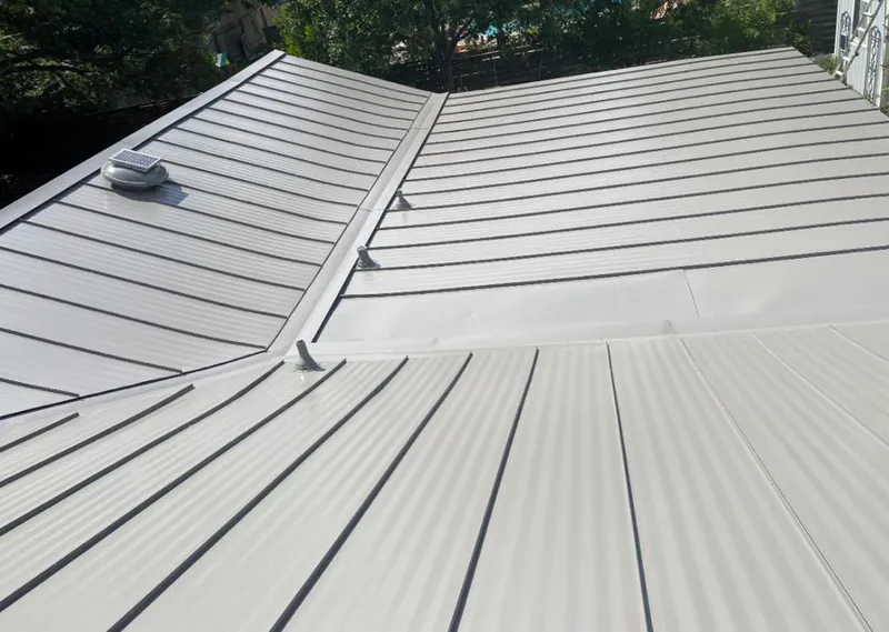 Solar attic fan installed on a metal roof for Roof Ventilation in Placerville